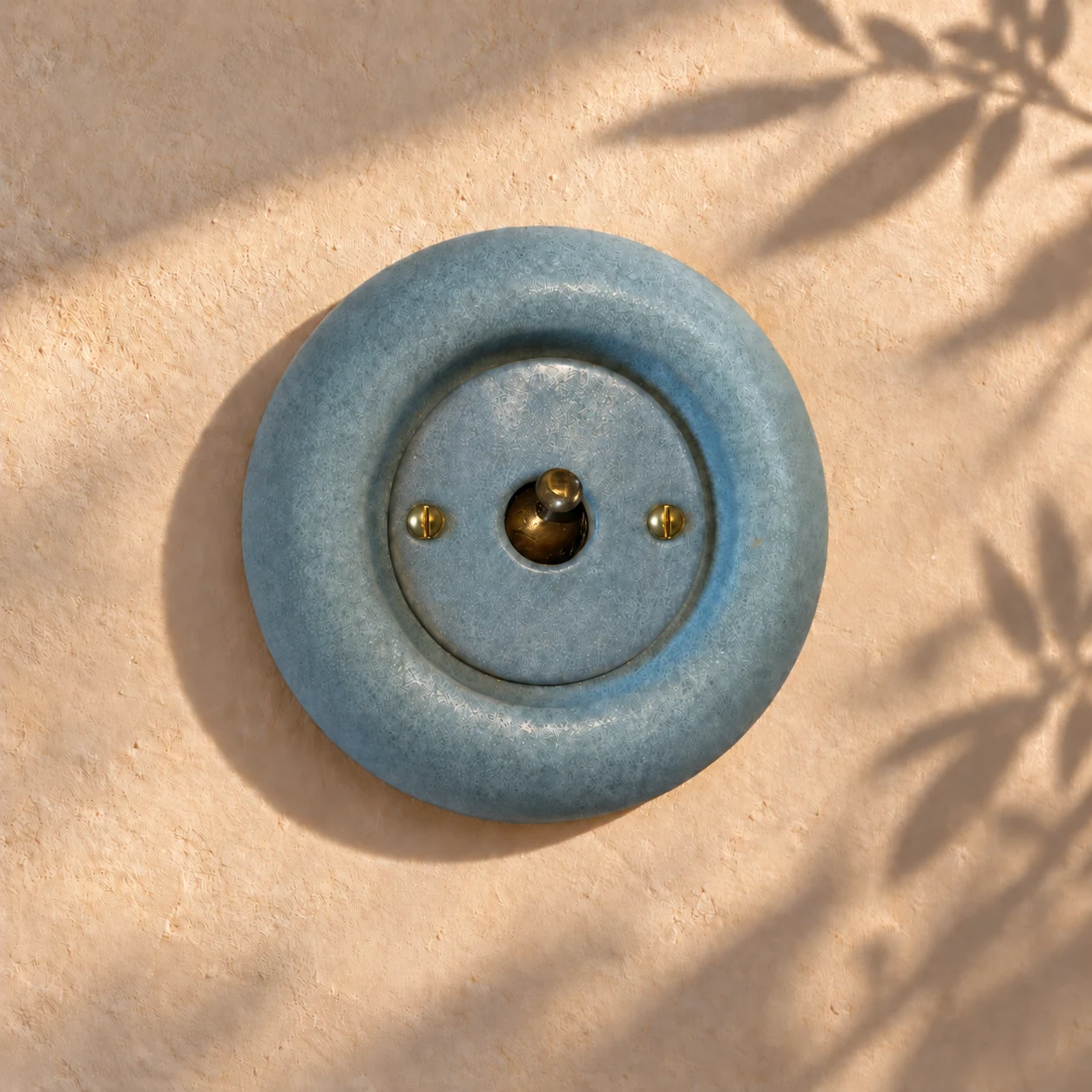 Single blue-grey ceramic toggle switch with brass fixings